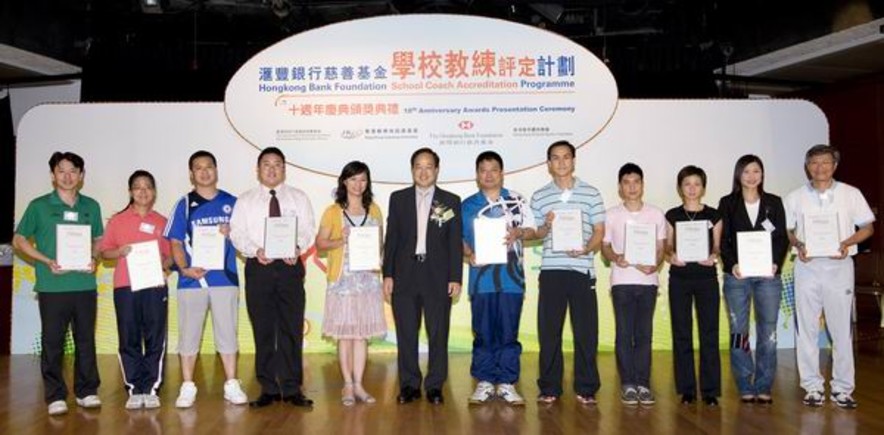 <p>Tony Lai, Chief Curriculum Development Officer (PE) of the Education Bureau presents the School Coaches Awards (PE Teacher Category) to some of the recipients.</p>
