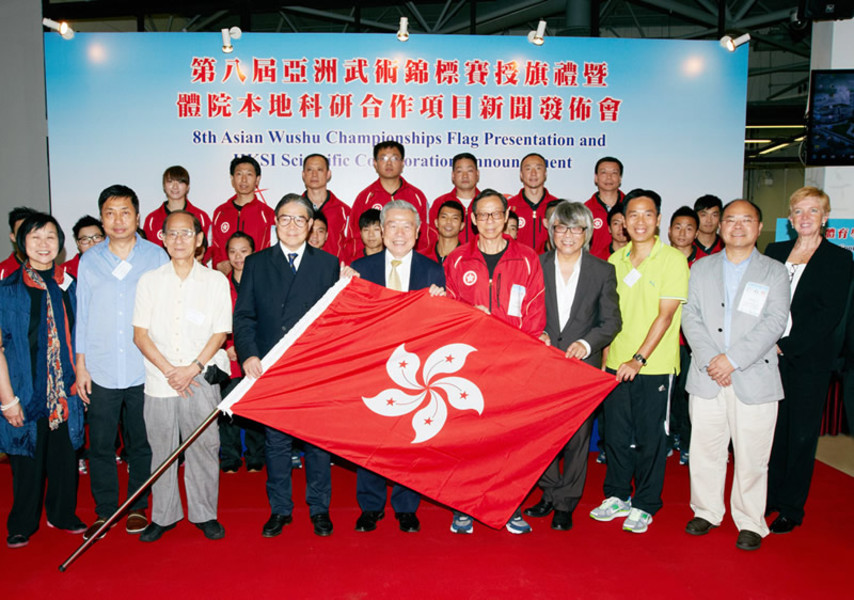 <p>Mr Timothy Fok GBS JP (4<sup>th</sup> from left, front row), President of the Sports Federation &amp; Olympic Committee of Hong Kong, China (SF&amp;OC) presented the HKSAR flag to Mr Wan Hing-yuen (5<sup>th</sup> from left, front row), Taolu Team Manager and Mr Luk Chung-mow(5<sup>th</sup> from right, front row), Sanshou Team Manager of the Hong Kong Wushu Team for the Championships and pledge for huge success at the competition.</p>
