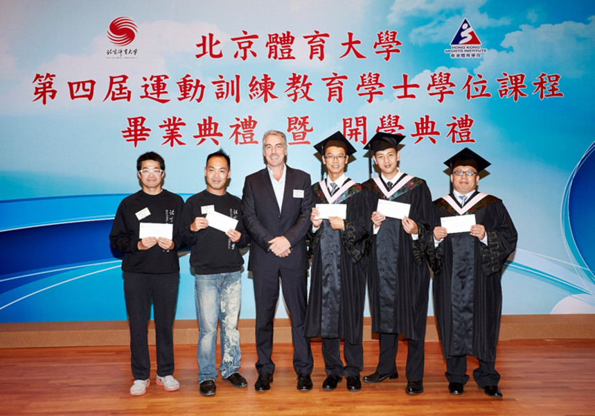 <p>Mr Jonathan McKinley JP, Deputy Secretary for Home Affairs (3<sup>rd</sup> from left), presents scholarship awards to five outstanding students namely (from left) Cheung Kin-fun (athletics), Chui Siu-kei and Chung Chun-wa (swimming) as well as Hui Wai-man and Leung Wing-kai (basketball).</p>
