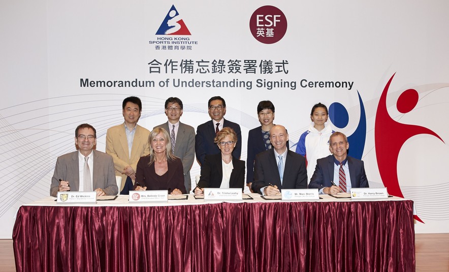 <p>The MOU is signed by Dr Trisha Leahy BBS (1<sup>st</sup> row, 3<sup>rd</sup> left), Chief Executive of the HKSI; Mrs Belinda Greer (1<sup>st</sup> row, 2<sup>nd</sup> left), Chief Executive Officer of ESF; Dr Ed Wickins (1<sup>st</sup> row, 1<sup>st</sup> left), Principal of King George V School; Dr Harry Brown (1<sup>st</sup> row, 1<sup>st</sup> right), Principal of Renaissance College; and Mr Marc Morris (1<sup>st</sup> row, 2<sup>nd</sup> right), Principal of Sha Tin College; with the signatures witnessed by Mr Tony Yue Kwok-leung MH JP (2<sup>nd</sup> row, 2<sup>nd</sup> left), Chairman of the Elite Sports Committee; Miss Petty Lai Chun-yee, Principal Assistant Secretary for Home Affairs (Recreation &amp; Sport) (2<sup>nd</sup> row, 2<sup>nd</sup> right); Mr Carlson Tong Ka-shing SBS JP (2<sup>nd</sup> row, 3<sup>rd</sup> left), Chairman of the HKSI; the HKSI&rsquo;s Head Table Tennis Coach Chan Kong-wah (2<sup>nd</sup> row, 1<sup>st</sup> left); and wushu athlete Shum Hui-yu (2<sup>nd</sup> row, 1<sup>st</sup> right).</p>
