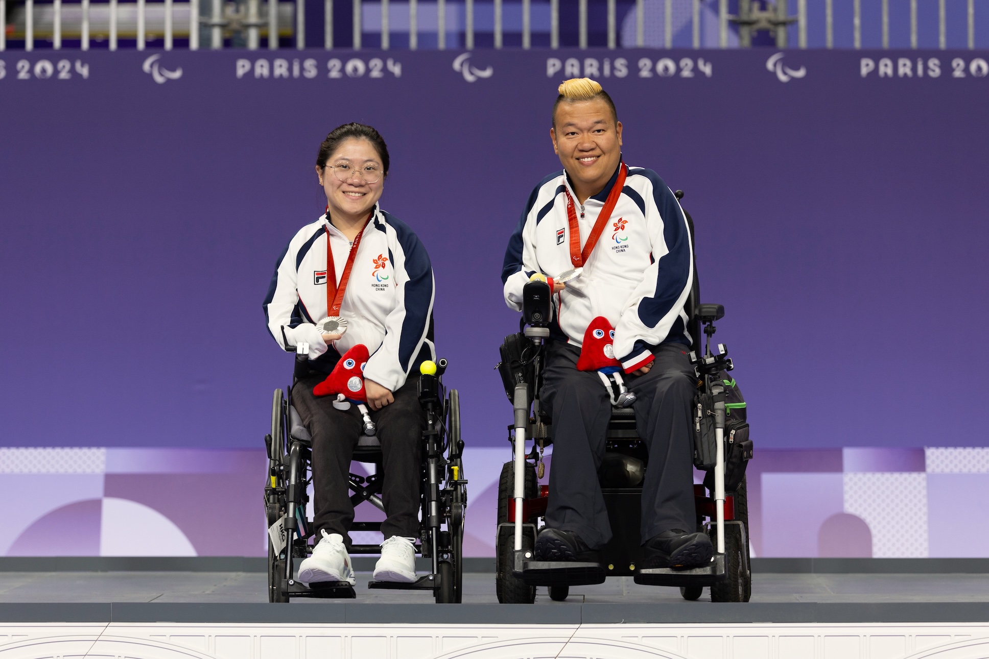Cheung Yuen (left) and Leung Yuk-wing (right, boccia)
