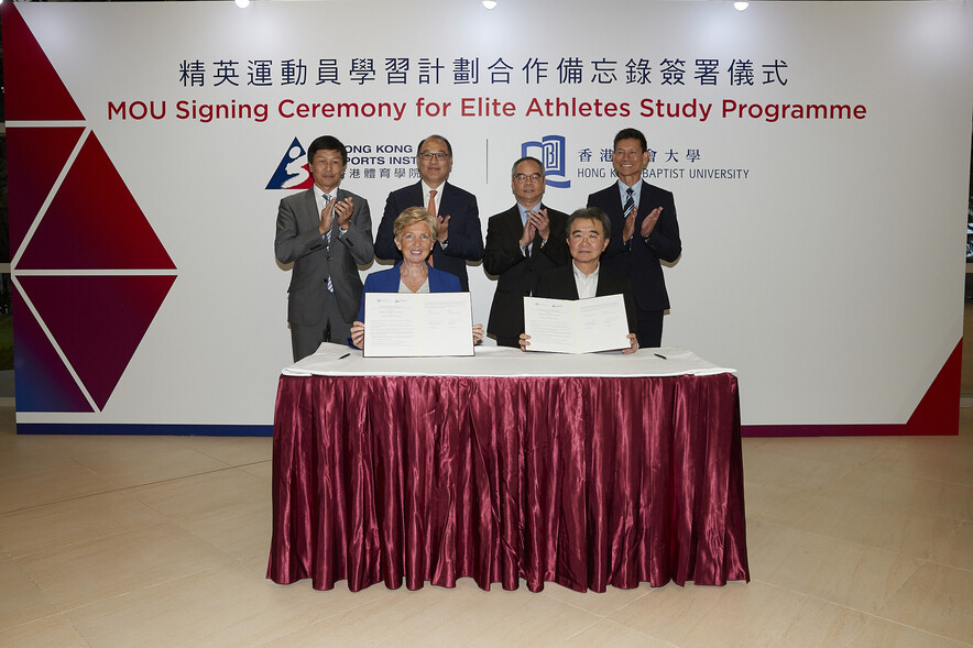 <p>Witnessing by The Hon Lau Kong-wah JP (2nd right, back row), Secretary for Home Affairs, Mr Yeung Tak-keung JP (1st left, back row), Commissioner for Sports, Dr Lam Tai-fai SBS JP, Chairman of the Hong Kong Sports Institute (HKSI) (2nd left, back row), and Professor Chung Pak-kwong, Head of Department of Physical Education of the Hong Kong Baptist University (HKBU) (1st right, back row). Professor Roland Chin Tai-hong BBS JP (right, front row), President and Vice-Chancellor of the HKBU, and Dr Trisha Leahy BBS (left, front row), Chief Executive of the HKSI, sign the MOU for elite athletes study programme.</p>
