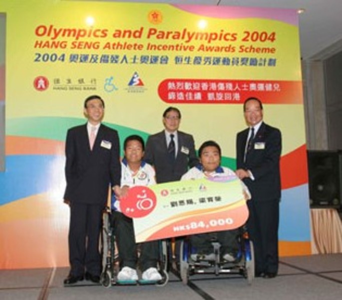 <p>Boccia pairs Leung Yuk-wing (left) and Lau Yan-chi are awarded HK$84,000 for their gold medal in the mixed event.</p>
