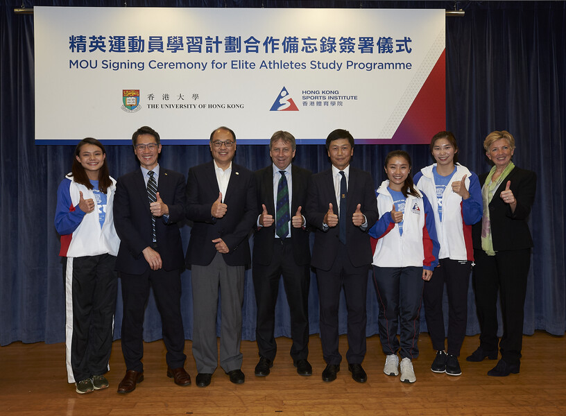 <p>Witnesses including Mr Yeung Tak-keung JP, Commissioner for Sports (4<sup>th</sup> right), Professor Peter Mathieson, President and Vice-Chancellor of the University of Hong Kong (HKU) (4<sup>th</sup> left) and Dr Lam Tai-fai SBS JP, Chairman of the Hong Kong Sports Institute (HKSI) (3rd left) together with signatories Dr Trisha Leahy BBS, Chief Executive of the HKSI (1<sup>st</sup> right) and Professor John Kao, Vice-President and Pro-Vice-Chancellor (Global) of the HKU (2<sup>nd</sup> left), take a group photo with the elite athletes to drive the launch of the cooperation.</p>
