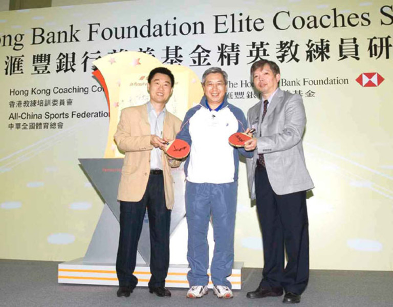 <p>Hui Jun, National Coach of the Hong Kong, China Table Tennis Team (right) and Chan Kong-wah, Coach of the Hong Kong, China Men&#39;s Table Tennis Team (left) present a table tennis racket autographed by Olympic silver medallists Ko Lai-chak and Li Ching to Dr Eric Li, Chairman of the HKSI (middle), in appreciation of the comprehensive support provided by the HKSI for the elite training.</p>
