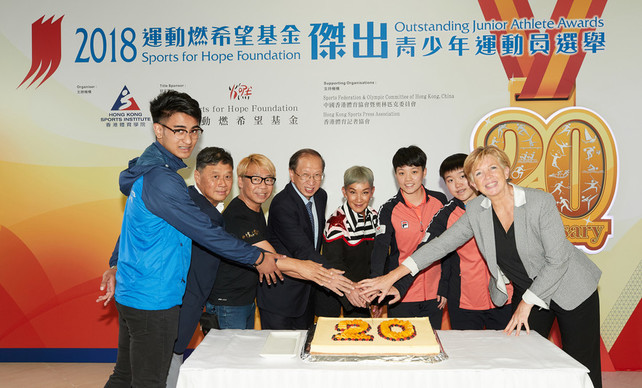 Miss Marie-Christine Lee, founder of the Sports for Hope Foundation (4<sup>th</sup> right); Mr Pui Kwan-kay SBS MH, Vice-President of the Sports Federation & Olympic Committee of Hong Kong, China (SF&OC) (4<sup>th</sup> left); Mr Ronnie Wong JP, Hon Secretary General of SF&OC (2<sup>nd</sup> left); Mr Raymond Chiu, Vice Chairman of the Hong Kong Sports Press Association (3<sup>rd</sup> left); Dr Trisha Leahy BBS, Chief Executive of the Hong Kong Sports Institute (1<sup>st</sup> right), and past Awards recipients participated in a cake-cutting ceremony celebrating the 20<sup>th</sup> anniversary of the Awards.