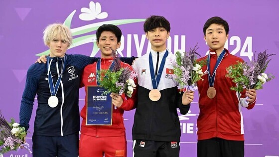 Fencer Luk Chun-lok (2<sup>nd</sup> from right) won a bronze medal at