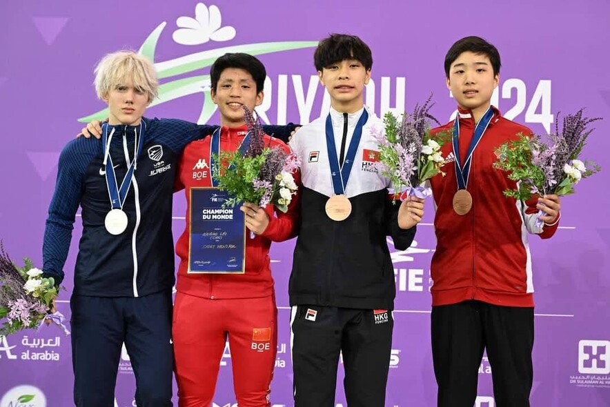 Fencer Luk Chun-lok (2nd from right) won a bronze medal at the World